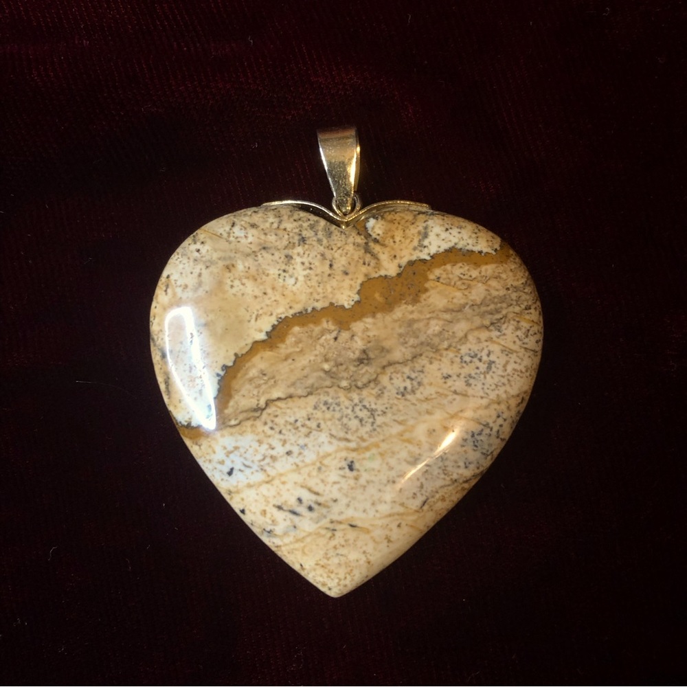 Large stone heart shape gold tone pendent.